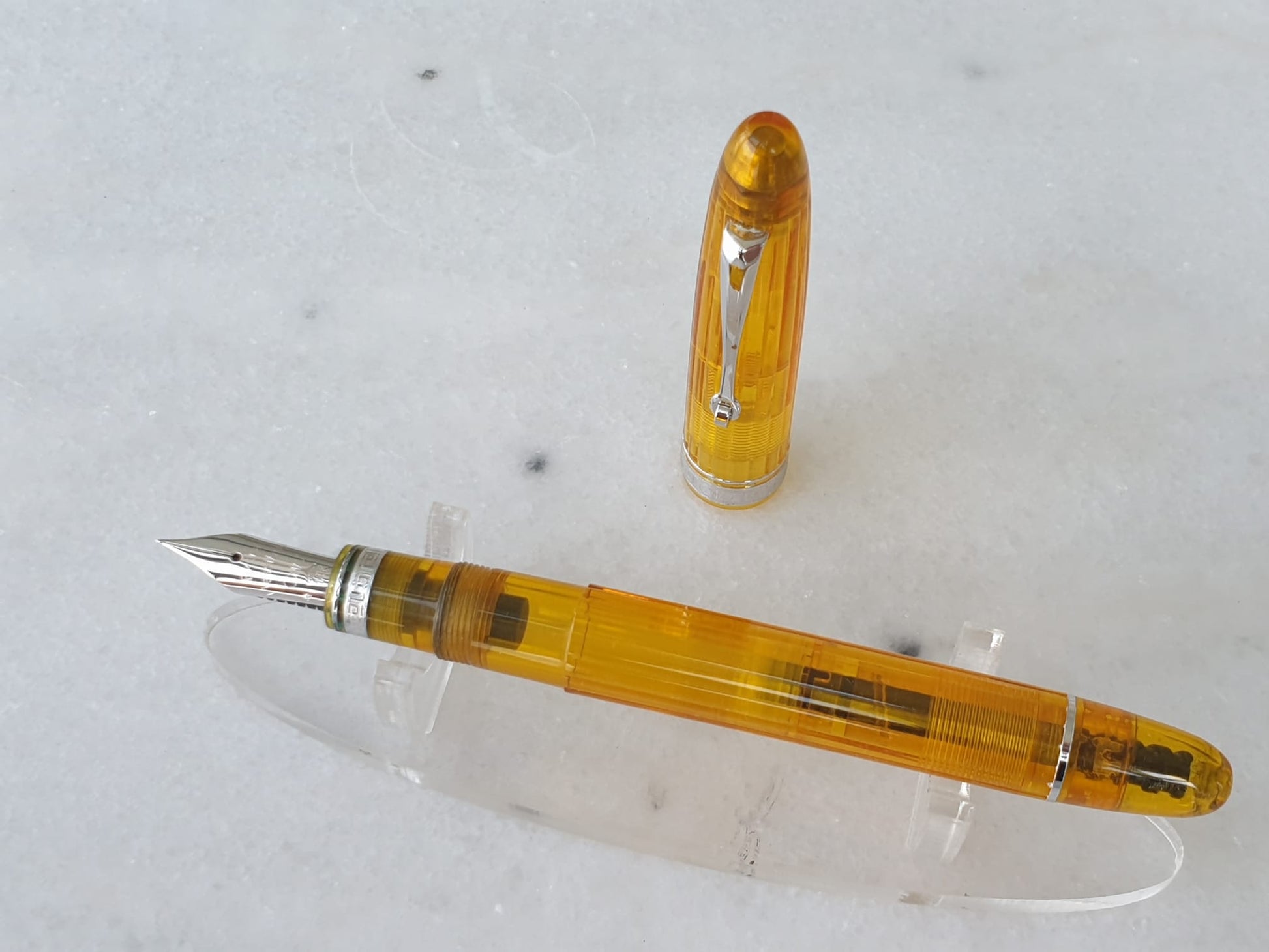 Omas Cocktail Lemon fountain pen uncapped, showing 14K gold nib