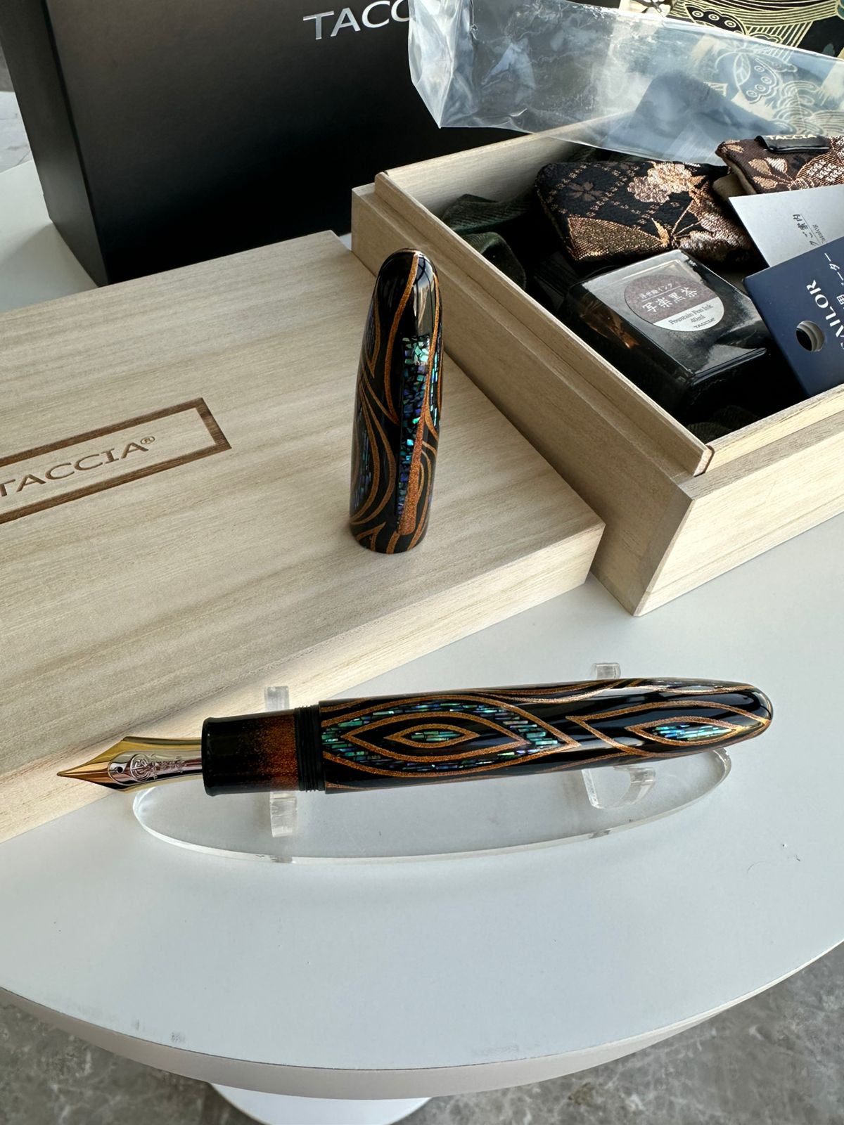 TACCIA Miyabi Empress Sunset Peacock fountain pen uncapped, showing nib